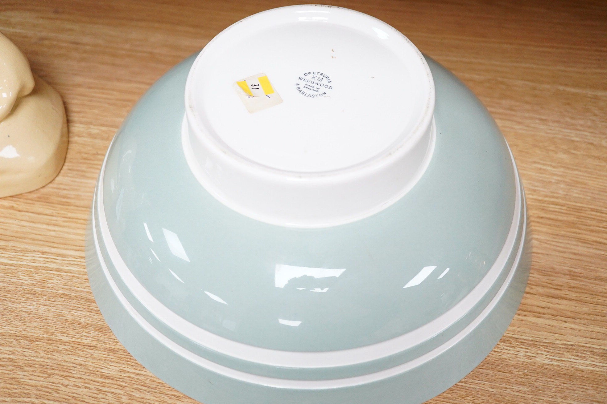 Keith Murray for Wedgwood, a large celadon footed bowl, stamped to the base, 28cm in diameter